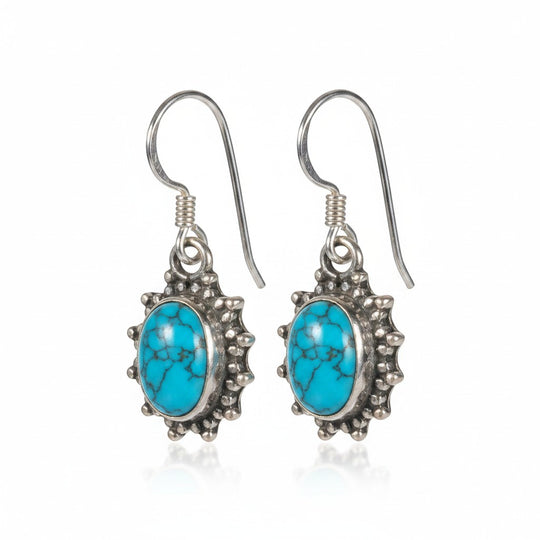 Sinnikäs Malachit Ohrhänger aus Sterling-Silber mit rhodinierter Oberfläche und blaugrünen Malachit-Steinen.